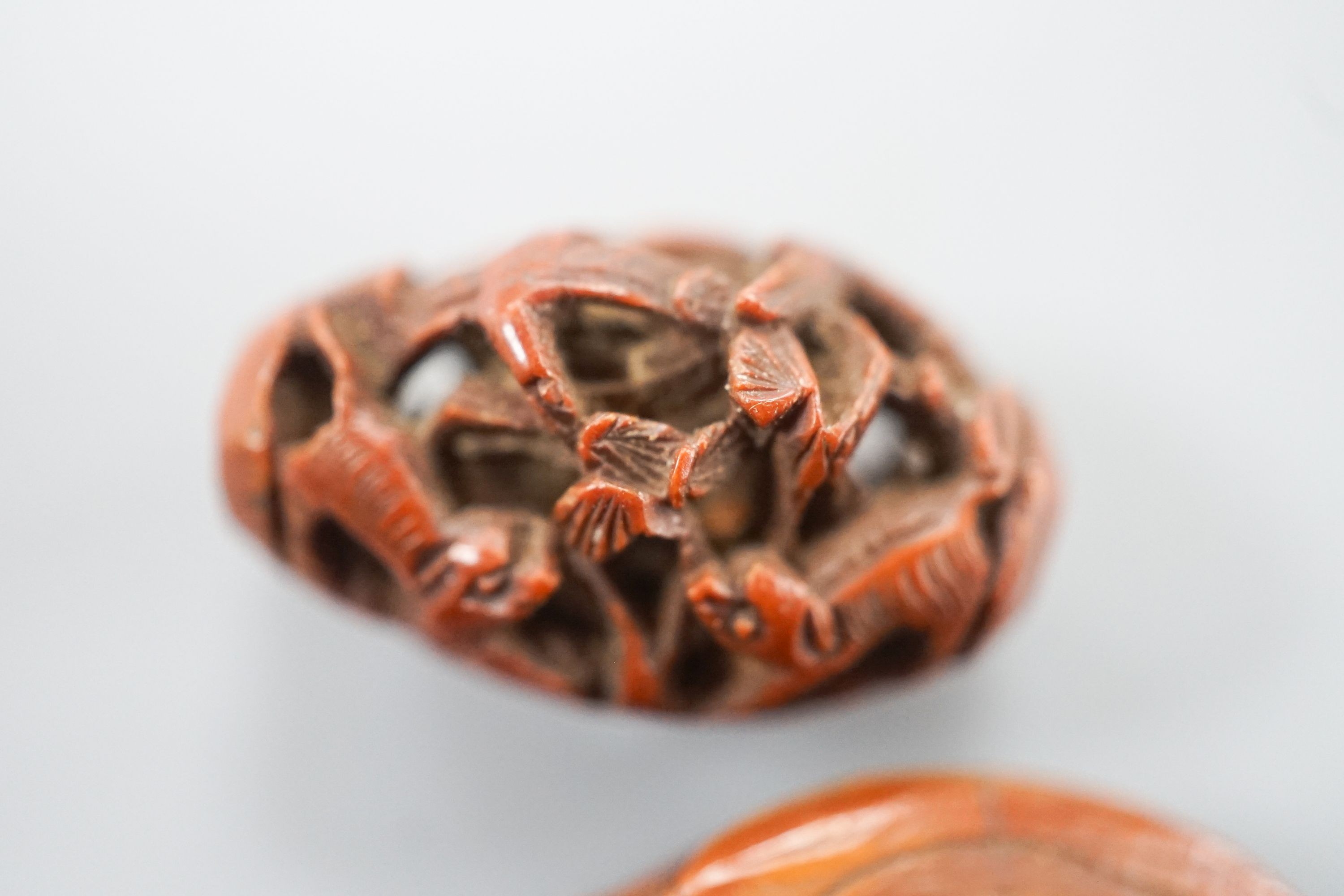 Two Chinese peach stone carvings